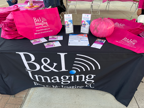 Community members spreading breast cancer awareness at a local event