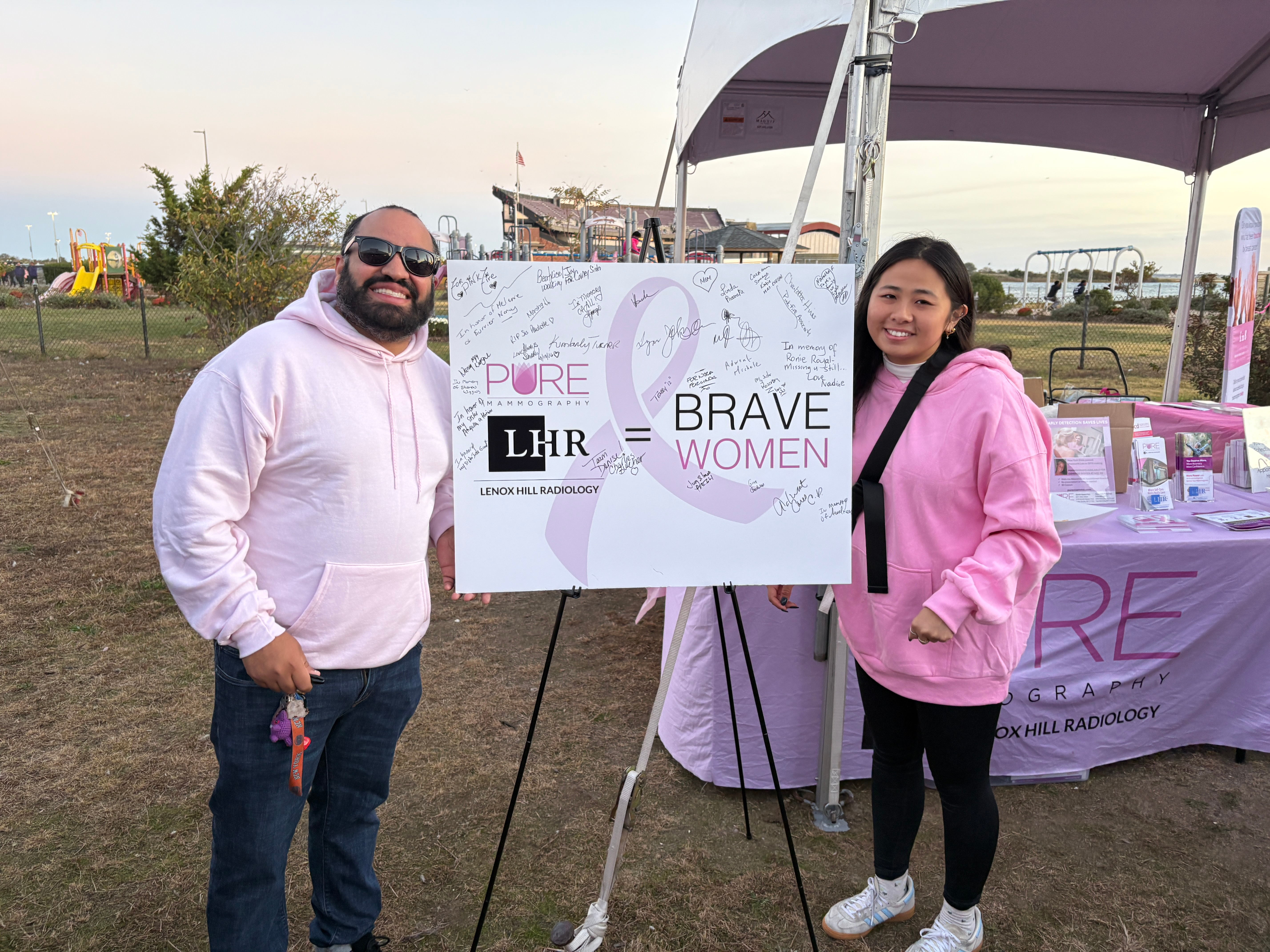 Community members spreading breast cancer awareness at a local event