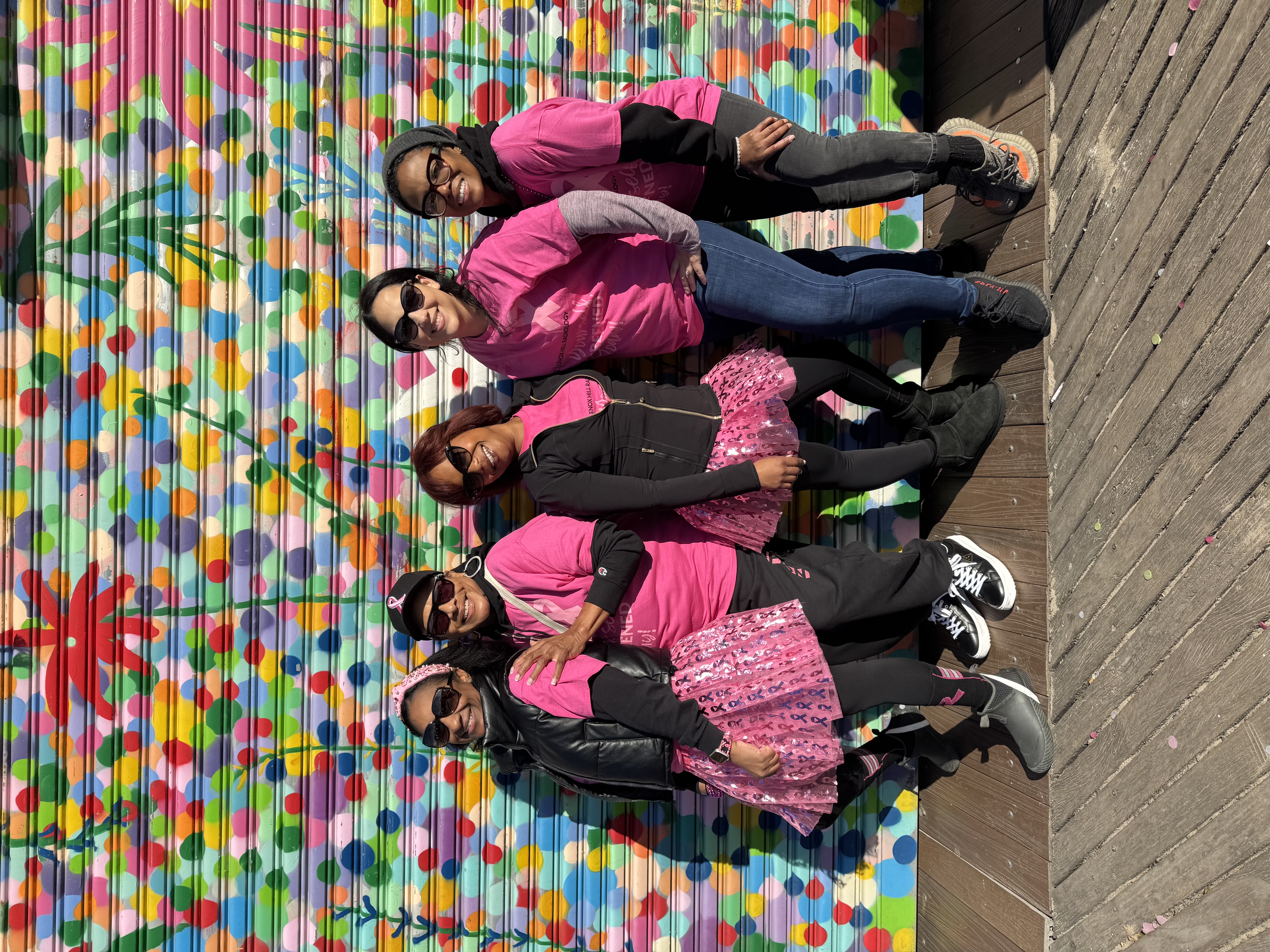 Community members spreading breast cancer awareness at a local events