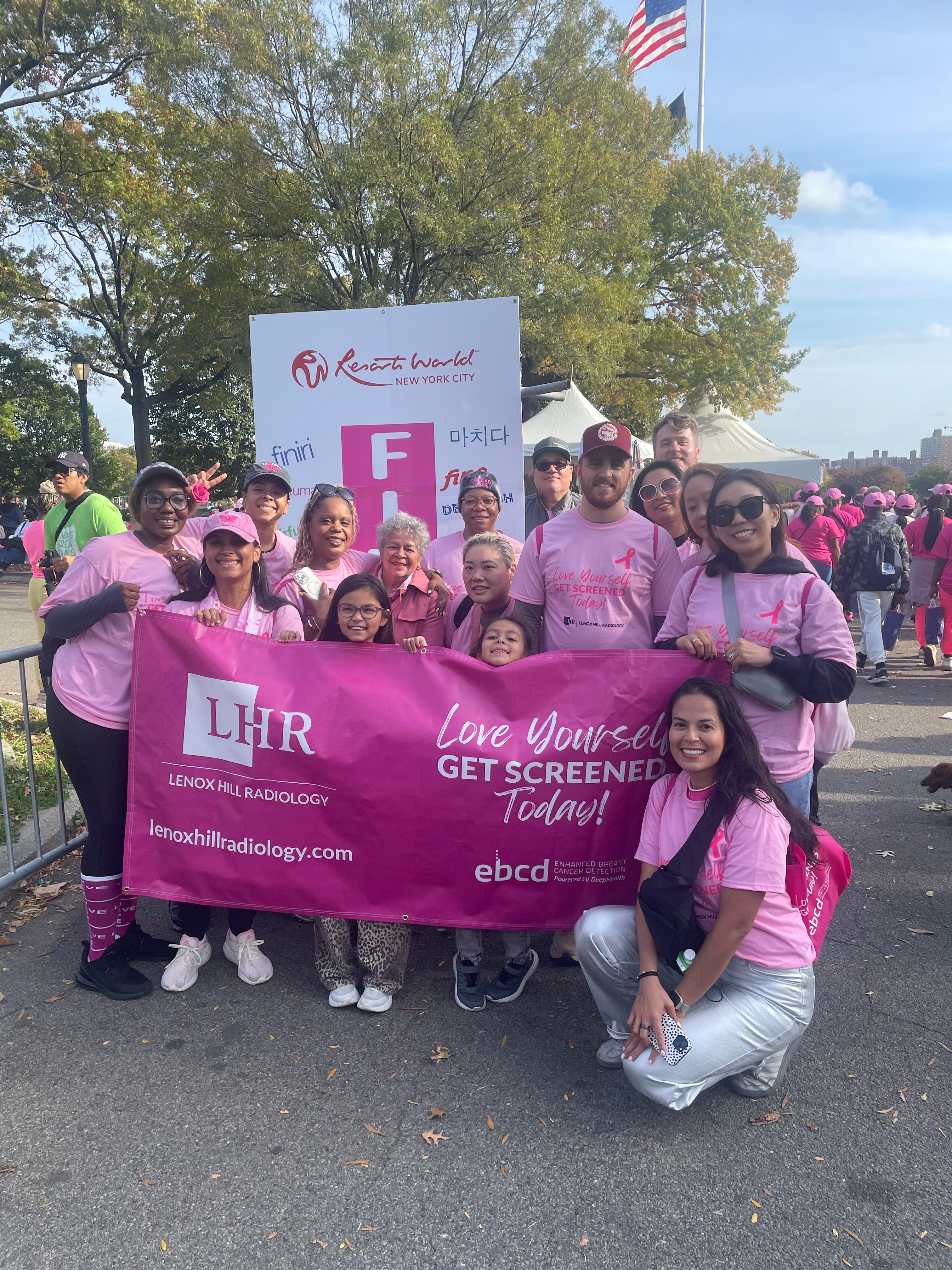 Community members spreading breast cancer awareness at a local event