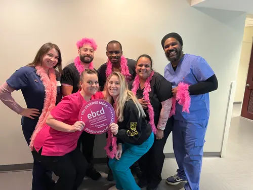 Community members spreading breast cancer awareness at a local event