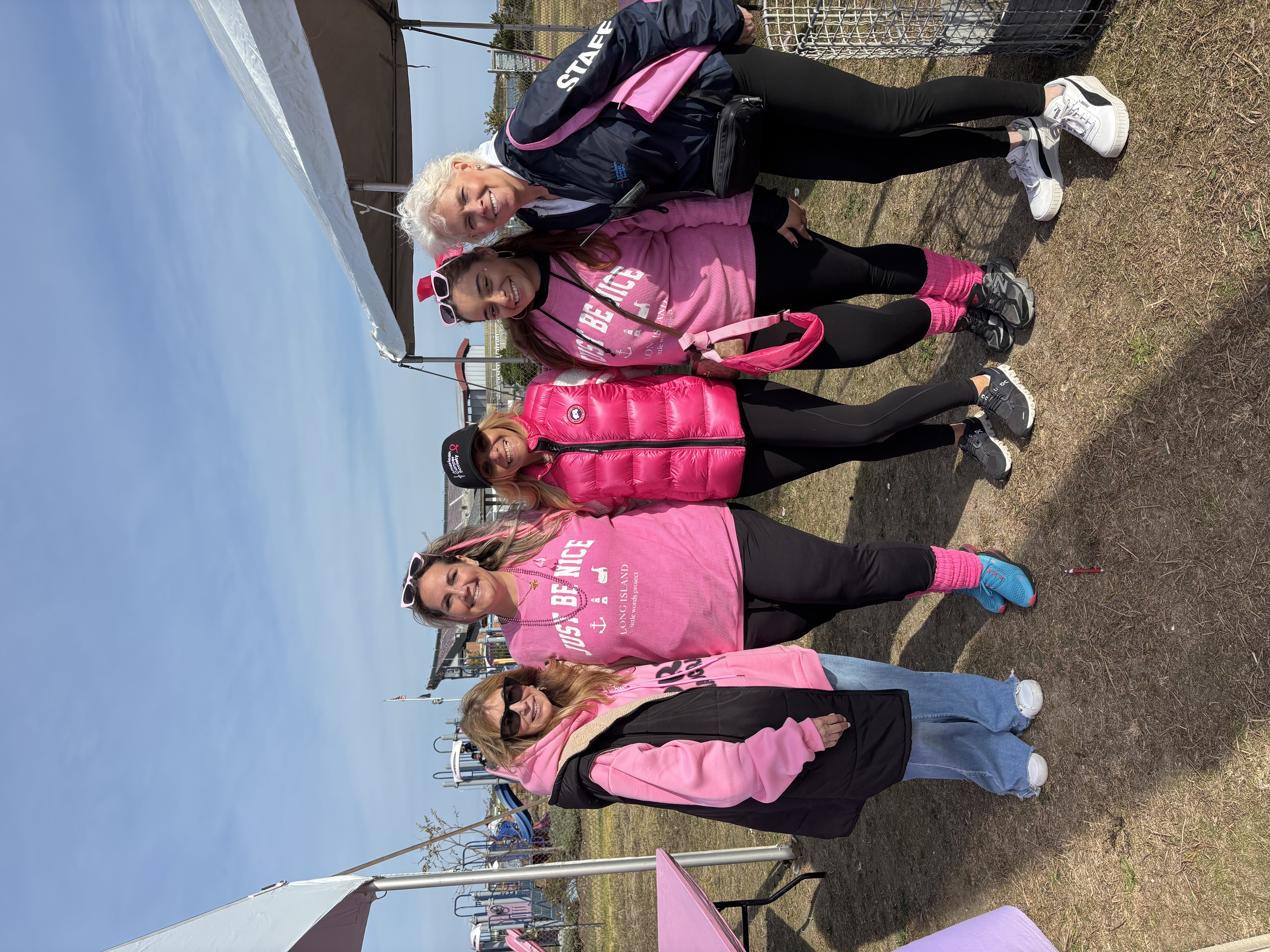 Community members spreading breast cancer awareness at a local event