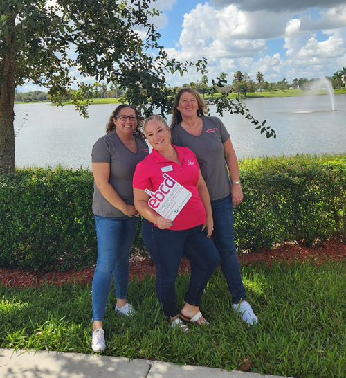 Community members spreading breast cancer awareness at a local event